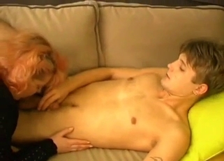 Chubby redhead strokes her son's massive cock
